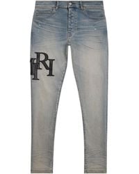 Amiri - Staggered Logo Skinny Jeans - Lyst