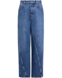 Alaïa - Twisted Straight-Leg Jeans - Lyst