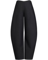 Alaïa - Wool Curved-Leg Trousers - Lyst