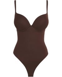 Skims - Ultimate Body Thong Bodysuit - Lyst
