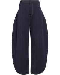 Alaïa - Side-Split Petal Round Jeans - Lyst