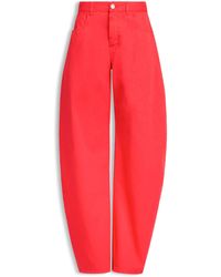 Alaïa - High-Waist Barrel-Leg Denim Trousers - Lyst