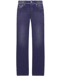 McQueen - Slashed Zip Low-Rise Bootcut Jeans - Lyst