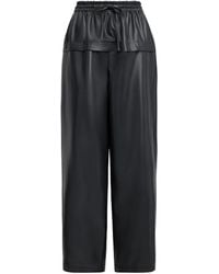 Alaïa - Leather Peplum Trousers - Lyst