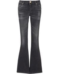 Balmain - Low-rise Flared Jeans - Lyst