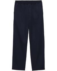 Prada - Triangle-Appliqué Slim-Fit Cotton Trousers - Lyst