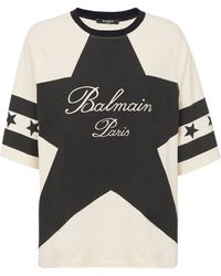 Balmain - Cropped T-shirt With Star And Logo Prints - Lyst
