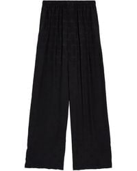 Balenciaga - Silk Logo Print Trousers - Lyst