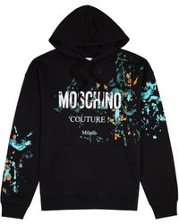 Moschino - Paint-splatter Logo Hooded Cotton Sweatshirt - Lyst