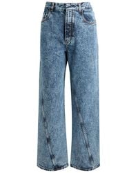 Alaïa - Twisted Straight-Leg Jeans - Lyst