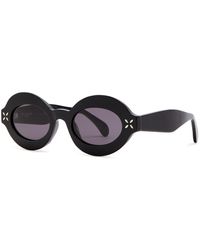 Alaïa - Alaïa Petal Oval-frame Sunglasses - Lyst