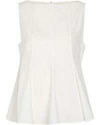 KHAITE - Marita Peplum Cotton-Poplin Top - Lyst