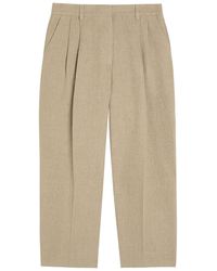 TOTEME - Pleated Tapered-Leg Linen Trousers - Lyst