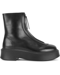 The Row Canal Leather Ankle Boots in Black | Lyst