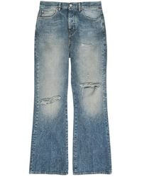 Amiri - Slashed Distressed Bootcut Jeans - Lyst