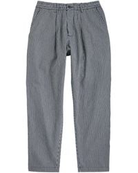 Universal Works - Pleated Striped Cotton-Twill Trousers - Lyst