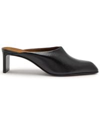 KHAITE - Colt 50 Glossed Leather Mules - Lyst