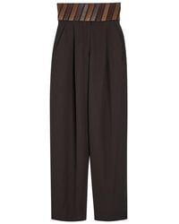 Alaïa - Panelled Belted Wool Trousers - Lyst