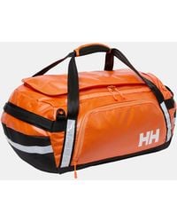 Helly Hansen - Guide Borsone 90L Arancione - Lyst