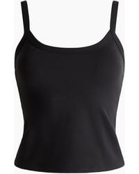 H&M - Sport-Tanktop mit integriertem BH und SoftMove - Lyst
