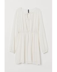 LA PERLA | Jacke aus Wolle mit Stretch mit Volant aus Leavers Spitze in Schwarz LA PERLA | Jacke aus Wolle mit Stretch mit Volant aus Leavers Spitze in Schwarz