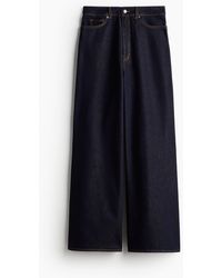 H&M - Glitzernde Jeans mit weitem Bein - Lyst