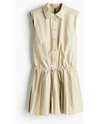 H&M - Kleid mit Schulterpolstern und plissiertem Jupe - Lyst
