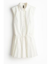 H&M - Kleid mit Schulterpolstern und plissiertem Jupe - Lyst