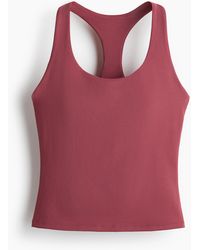 H&M - Sporttop mit integriertem BH und DryMove - Lyst