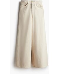 H&M - Weite Jeans mit Flechtdetail - Lyst
