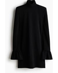 H&M - Glitterende Jurk Met Schoudervullingen - Lyst
