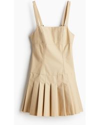 H&M - Kleid mit tiefem Rückenausschnitt und Plisseejupe - Lyst