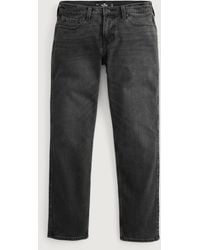 Hollister - Markentypische Slim Straight Jeans in verblasstem Schwarz - Lyst