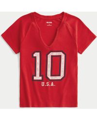 Hollister - Lässiges Baby-Tee mit eingekerbtem Ausschnitt und USA-Grafik - Lyst