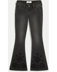 Hollister - Ultra Low-rise Floral Embroidery Washed Black Flare Jeans - Lyst