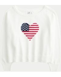 Hollister - Slouchy Off-the-shoulder Flag Heart Graphic Sweater - Lyst