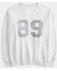 Hollister - Oversized-Sweatshirt mit eingekerbtem Ausschnitt und Athletic-Grafik - Lyst