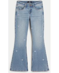 Hollister - Low Rise Flare Jeans in mittlerer Waschung mit Schmetterlingsstickerei - Lyst