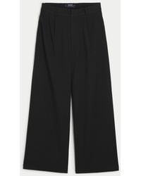 Hollister - Low-rise Pleated Wide-leg Pants - Lyst