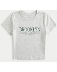 Hollister - Brooklyn Leisure Club Graphic Baby Tee - Lyst