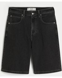 Hollister - Super Baggy Jeans-Shorts in verwaschenem Schwarz mit Katzengrafik - Lyst