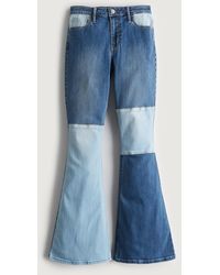 Hollister High Rise Flare Jeans im Patchwork-Design - Blau