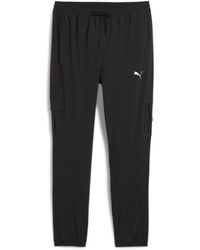 PUMA - Flex Open Hem Woven Joggers - Lyst