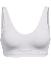 Under Armour - Smartform Evolution Mid Medium Impact Sports Bra - Lyst
