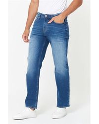 Studio - Loose Fit Mid Wash Jeans - Lyst