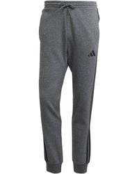 adidas - Essentials Fleece Tapered Cuff 3-Stripes Joggers - Lyst