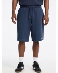 Guess - Jeans Logo Embroidered Shorts - Lyst