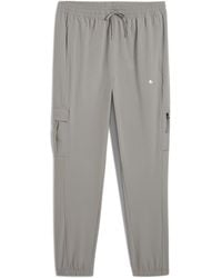 PUMA - Flex Open Hem Woven Joggers - Lyst