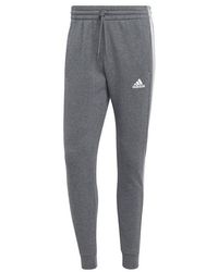 adidas - Essentials Fleece Tapered Cuff 3-stripes joggers M - Lyst