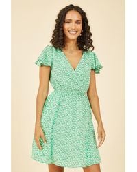 Mela London - Ditsy Print Wrap Skater Dress - Lyst